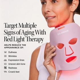 A woman holds the Solawave 2x Wrinkle Retreat LED Face Mask near her face. Text reads: Target multiple signs of aging with this treatment—supports wrinkle reduction, less dullness, and reduced redness.